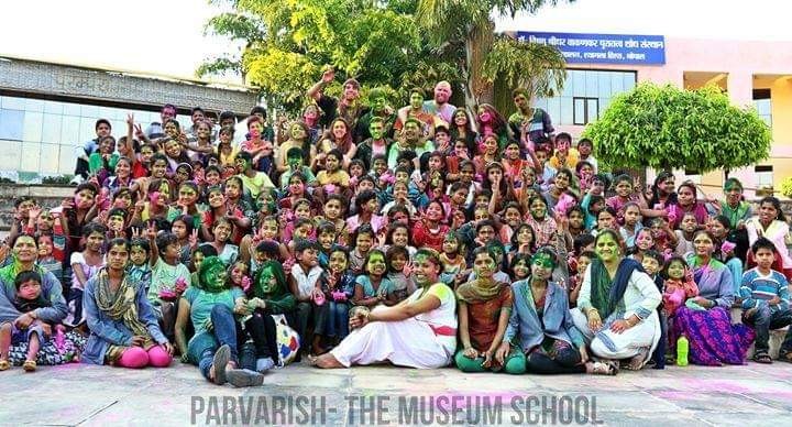 More than a hundred Parvarish children and teachers gathered for a group photograph, faces bright with festival colour.